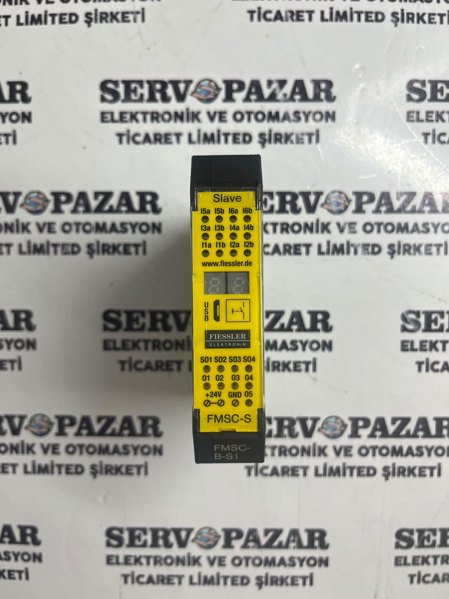 WhatsApp Image 2026-08-05 at 14.24.45 Fiessler FMSC-B-S1 Emniyet PLC Slave Modülü (12 DI / 4 Safe DO, SIL3/PLe) – İkinci El