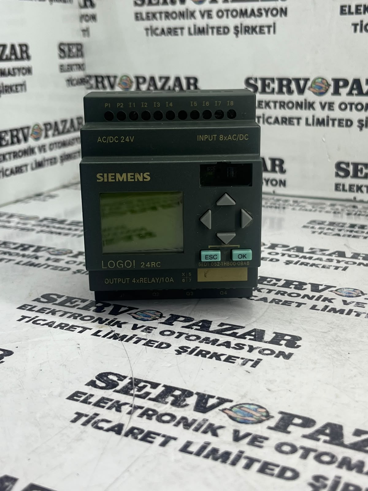 WhatsApp Image 2026-08-07 at 14.05.42 Siemens LOGO! 24RCL Mantıksal Kontrol Modülü (6ED1051-1HB00-0BA6 / 6ED1 051-1HB00-0BA6 – 24V AC/DC – 12 DI / 8 DO Röle – Ekranlı) – Worldwide Shipping